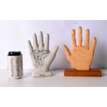 A ceramic palmistry hand together with a wooden hand 24 cm. (2).