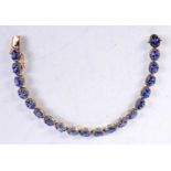 A 9CT GOLD DIAMOND AND TANZANITE BRACELET. 12 grams. 19 cm long.