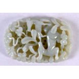 A CHINESE QING DYNASTY GREEN JADE RETICULATED PLAQUE. 9 cm x 6 cm.
