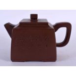A CHINESE YIXING POTTERY TEAPOT AND COVER 20th Century, bearing inscription to body. 14 cm wide.