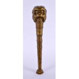 AN ANTIQUE JAPANESE GILT METAL MONKEY HEAD CANE HANDLE. 16 cm long.