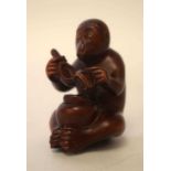 A JAPANESE BOXWOOD MONKEY. 7 cm x 5.5 cm.