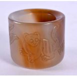 A CHINESE CARVED AGATE ARCHERS RING 20th Century. 3.5 cm wide.