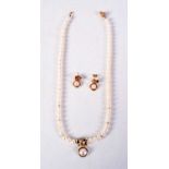 A 9CT GOLD AND PEARL GARNITURE. 24.8 grams. Largest 40 cm long. (3)