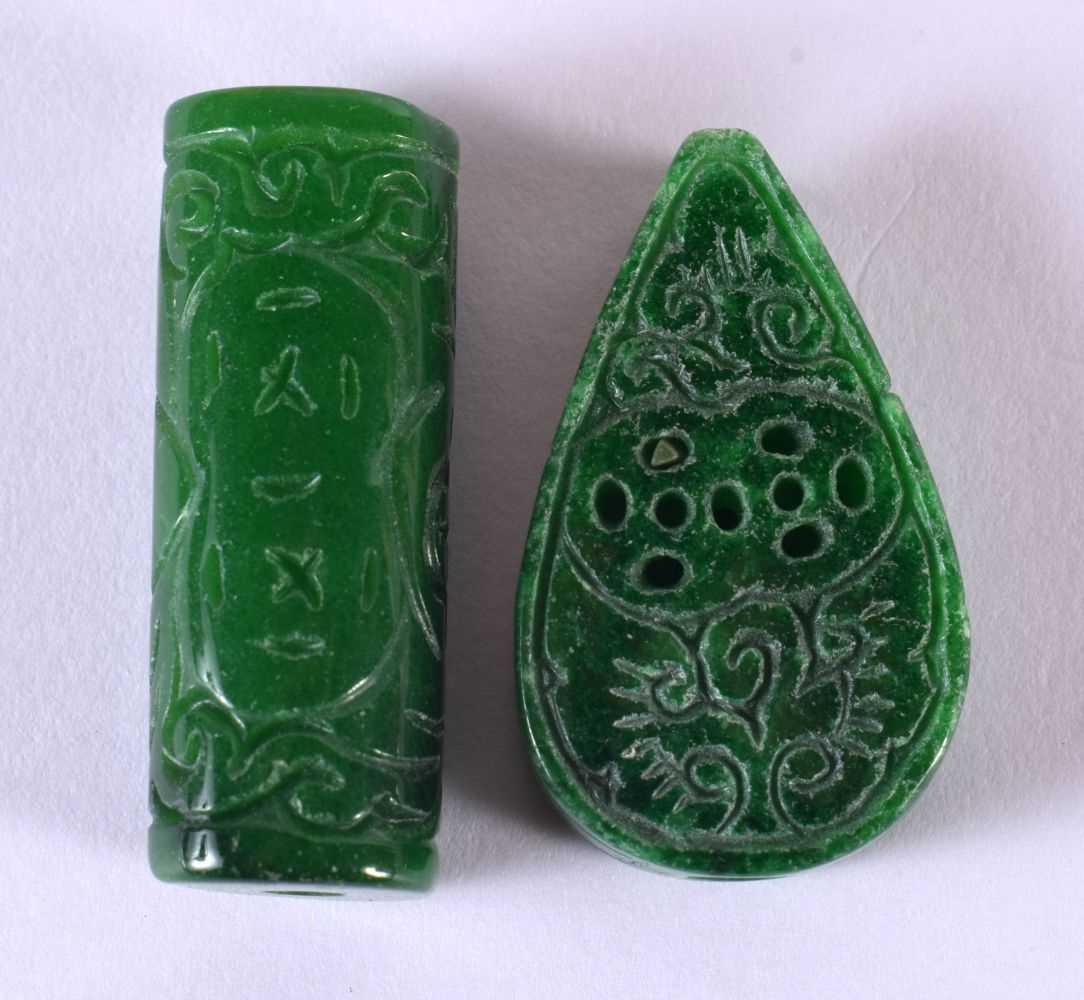 TWO CHINESE CARVED JADE TOGGLES 20th Century. Largest 4 cm long. (2)