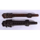 AN UNUSUAL PAIR OF 19TH CENTURY ASIAN CAMBODIAN BURMESE CARVED WOOD PIPES modelled with Buddhistic