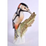 A LARGE KPM BERLIN PORCELAIN FIGURE OF A BIRD. 25 cm high.