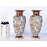 A pair of antique Lambeth Doulton vases with floral and impressed lace designs 20 cm (2).