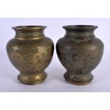 A PAIR OF 19TH CENTURY CHINESE BRONZE VASES decorated with beasts and foliage. 13 cm x 9 cm.