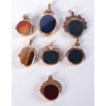 SEVEN 9CT GOLD MOUNTED AGATE FOBS. 75.5 grams. Largest 4.75 cm x 2.5 cm. (7)