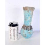 An Islamic blue glazed pottery vase. 26 cm.