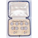 A CASED SET OF ART DECO 9CT & 18CT GOLD AND MOTHER OF PEARL DRESS STUDS. 11.7 grams. 1.25 cm x 1.