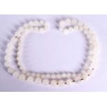 AN EARLY 20TH CENTURY CHINESE CARVED WHITE JADE NECKLACE Late Qing/Republic. 94 cm long, largest