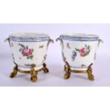 A PAIR OF 19TH CENTURY SEVRES PORCELAIN CACHE POT upon gilt bronze mounts. 13 cm x 15 cm.