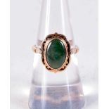 A 14CT GOLD AND JADE RING. 3.5 grams. M.