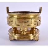 A 19TH CENTURY CHINESE TWIN HANDLED BRONZE CENSER ON STAND Qing. 1686 grams. 13 cm wide, internal