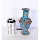 An Islamic blue glazed pottery vase. 20 cm.