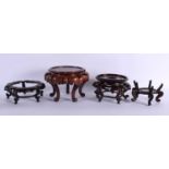 FOUR 19TH CENTURY CHINESE CARVED HARDWOOD DISPLAY STANDS Qing. Largest 16 cm x 14 cm. (4)