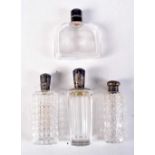 FOUR ANTIQUE SILVER TOPPED SCENT BOTTLES. Largest 12 cm x 3 cm. (4)