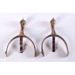 A PAIR OF ANTIQUE STIRRUPS. 9.5 cm x 6.5 cm.