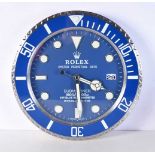 A Contemporary Rolex dealership style wall clock 34 cm.