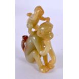A CHINESE CARVED YELLOWISH GREEN JADE MONKEY 20th Century. 8.5 cm x 4.5 cm.