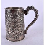 A 19TH CENTURY CHINESE EXPORT SILVER TANKARD decorated with foliage. 181 grams. 11 cm x 9 cm.