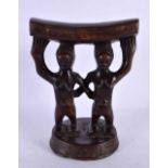 AN AFRICAN TRIBAL CARVED WOOD HEAD REST. 18 cm x 12 cm.