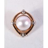 A 14CT GOLD PEARL AND DIAMOND PENDANT. 13.7 grams. 3.5 cm wide.