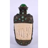 A 19TH CENTURY CHINESE TIBETAN WHITE METAL AND BONE SNUFF BOTTLE carved with figures. 9.5 cm x 5