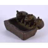 A JAPANESE BRONZE PIG TROUGH OKIMONO. 5 cm x 3 cm.