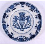 AN 18TH CENTURY DELFT BLUE AND WHITE ARMORIAL PLATE painted with a crest. 23 cm diameter.