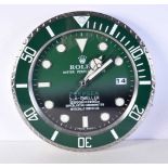 A Contemporary Rolex dealership style wall clock 34 cm.