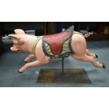 A CHARMING EARLY 20TH CENTURY CARVED AND PAINTED CAROUSEL PIG Attributed to Gustave Bayol. 85 cm x