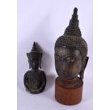 A 17TH/18TH CENTURY THAI BRONZE BUST OF A BUDDHA together with a similar smaller bronze. Largest