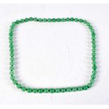 A JADE NECKLACE. 85 grams. 70 cm long.