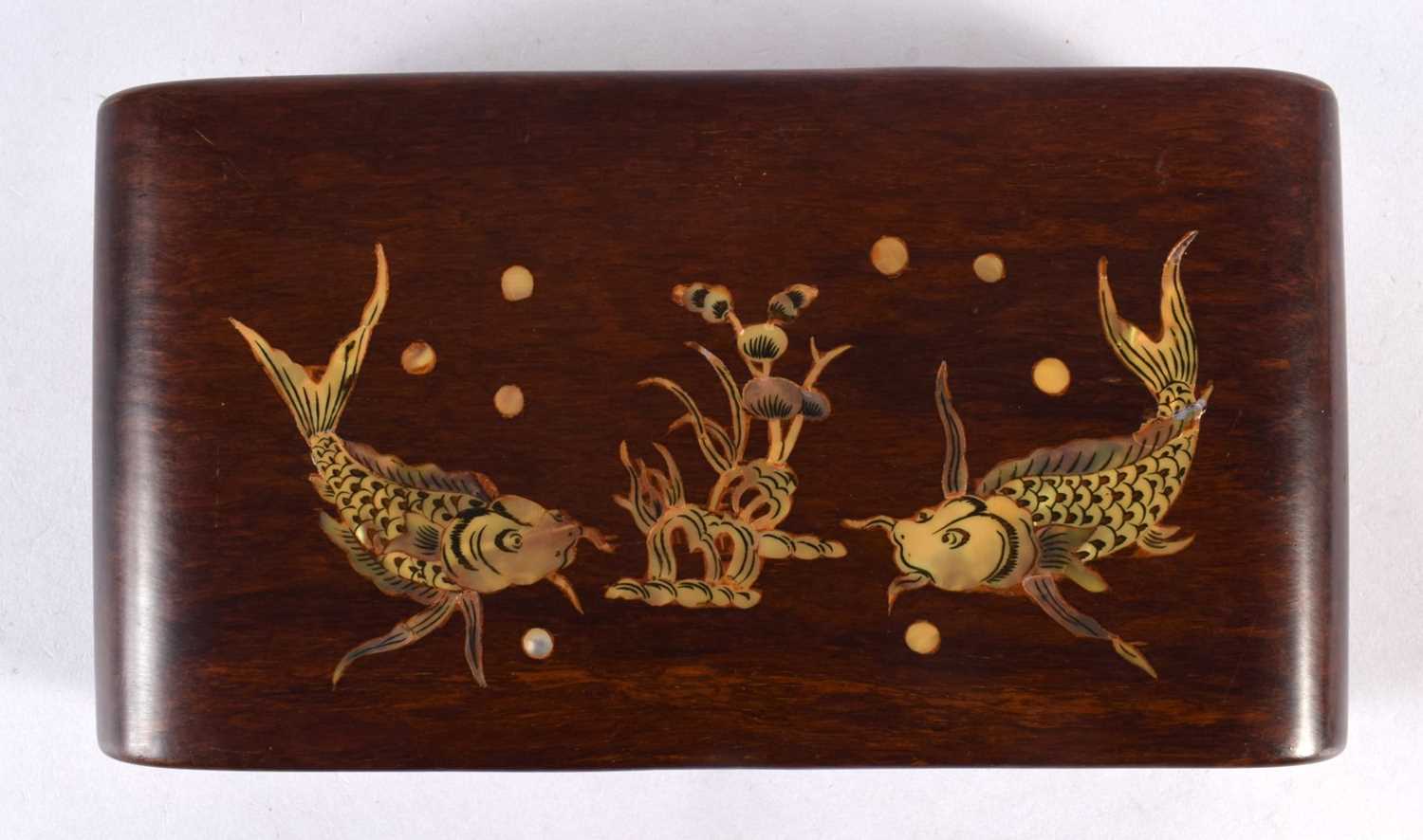 AN EARLY 20TH CENTURY CHINESE KOREAN MOTHER OF PEARL INLAID SCROLLING STAND inset with fish and