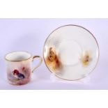 Royal Worcester coffee can and saucer painted with teal and partridge by Jas. Stinton, signed,