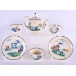 AN UNUSUAL WEDGWOOD TEA FOR TWO TEASET decorated with a red painted figure fishing within a