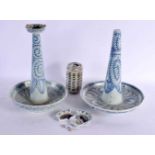A PAIR OF 19TH CENTURY CHINESE BLUE AND WHITE CANDLESTICKS painted with foliage. 32 cm x 18 cm.
