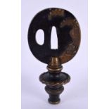 A 19TH CENTURY JAPANESE MEIJI PERIOD BRONZE TSUBA formed as a lamp finial. 10 cm x 5.5 cm.