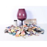 A large collection of match boxes together with a large glass 31 cm (Qty)