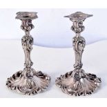 A PAIR OF ANTIQUE SILVER PLATED CANDLESTICKS. 421 grams. 11.5 cm x 7.5 cm.