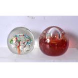 Two paperweights. 7cm.