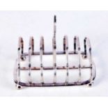 AN ART DECO SILVER TOAST RACK. 152 grams. 13 cm x 11.5 cm.