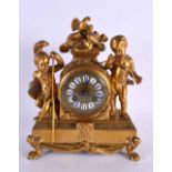 A 19TH CENTURY FRENCH GILT BRONZE MANTEL CLOCK formed with figures beside an enamelled dial. 27 cm x