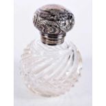 AN EDWARDIAN SILVER MOUNTED SCENT BOTTLE. Birmingham 1907. 9 cm x 6.25 cm.