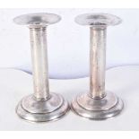 A PAIR OF SILVER CANDLESTICKS. 308 grams. 13 cm x 8 cm.