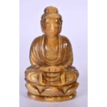 AN EARLY 20TH CENTURY CHINESE CARVED TIGERS EYE FIGURE OF A BUDDHA Late Qing/Republic. 10 cm x 5.5