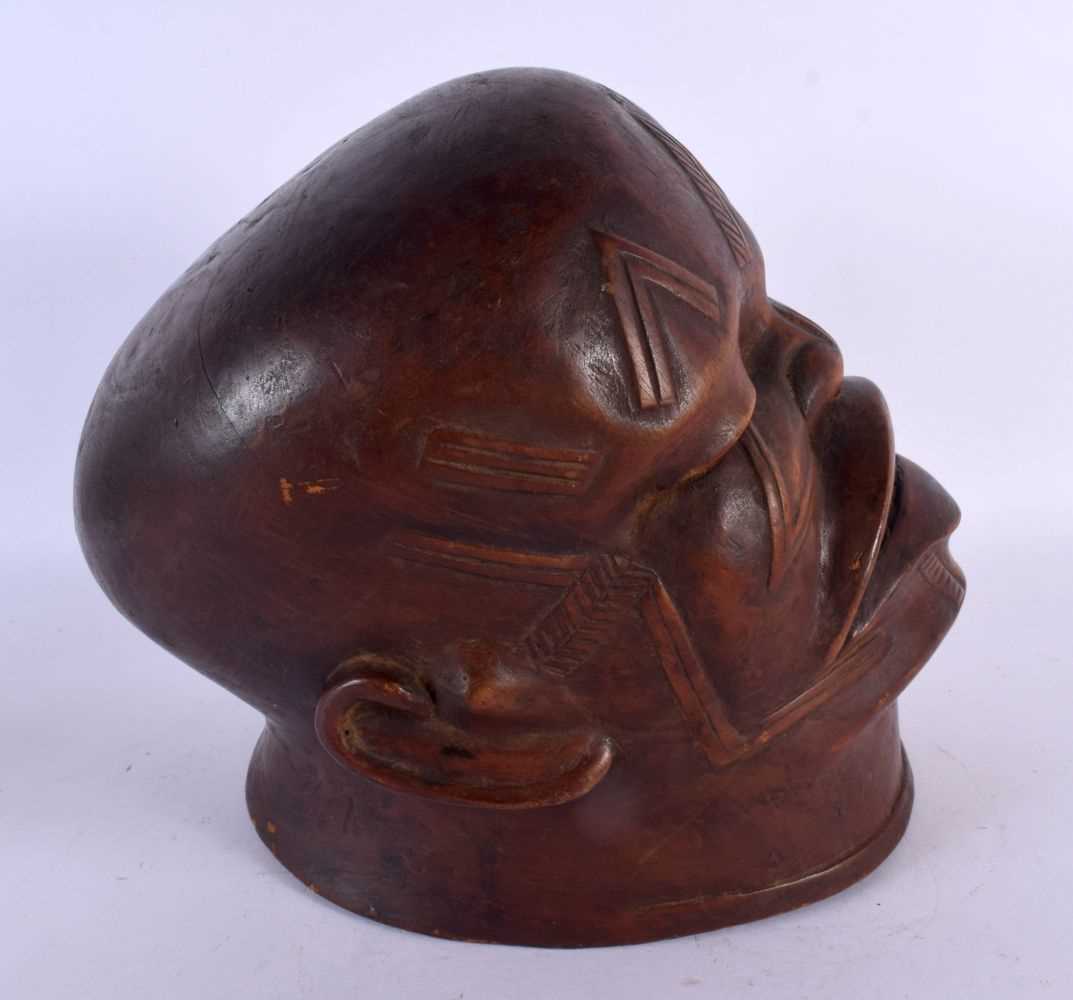 A GOOD EARLY 20TH CENTURY AFRICAN TRIBAL MAKONDE LIPIKO WOOD MASK used by an elder to celebrate - Image 3 of 4